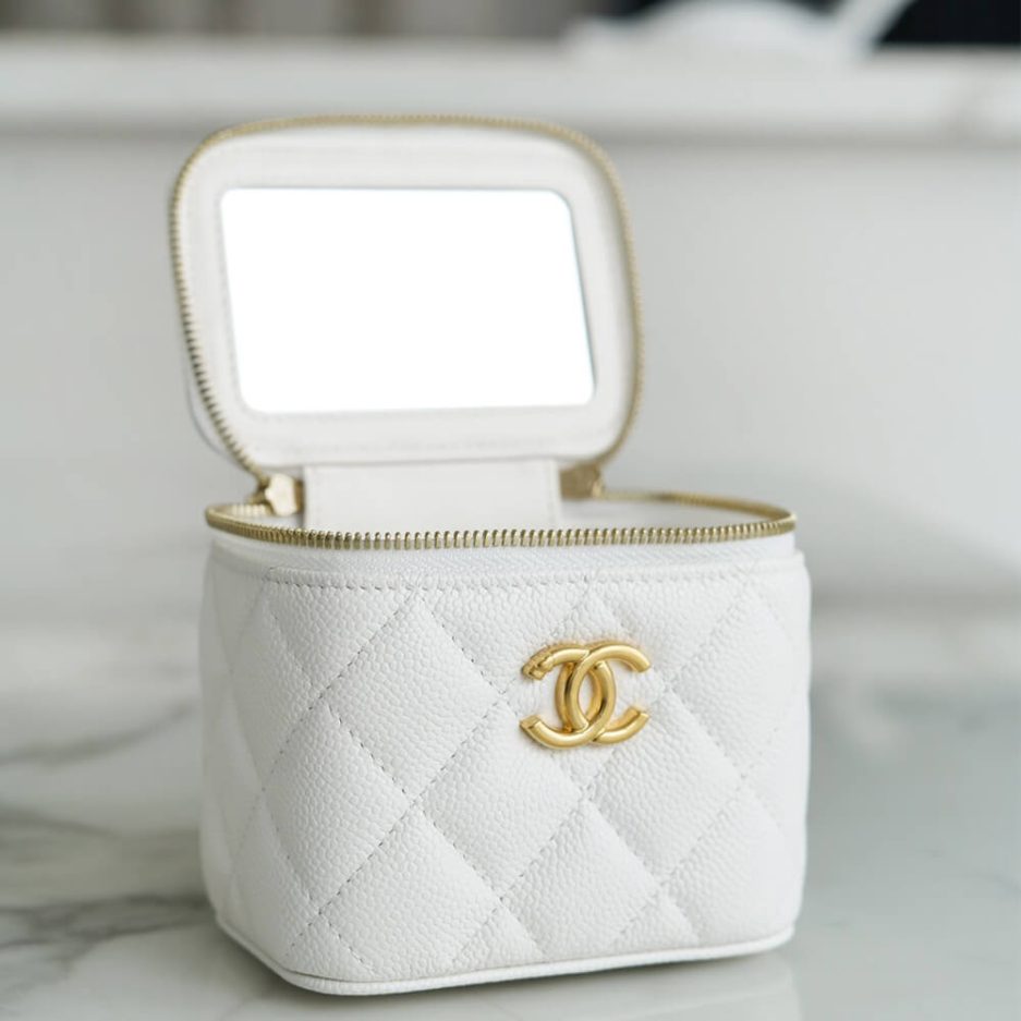 Ch*el small gold ball makeup bag